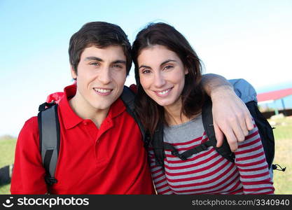 Couple hiking in countryside on beautiful fall day