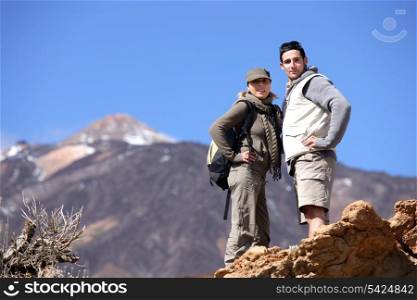 Couple hiking through the mountains