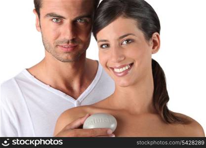 Couple holding a bar of soap