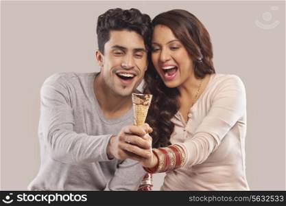 Couple holding an ice cream cone