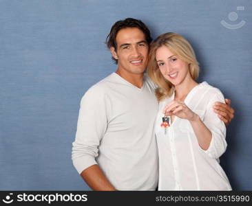 Couple holding brand new car key