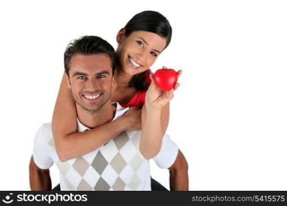 Couple holding heart-shaped object