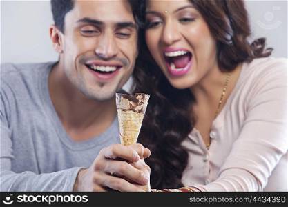 Couple holding ice cream cone