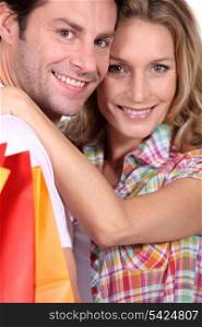 Couple holding shopping bags