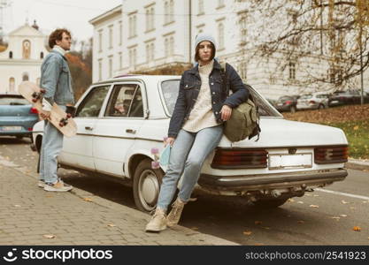 couple holding their skateboards