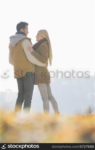 Couple hugging during autumn in park