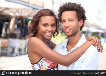 Couple hugging in a street
