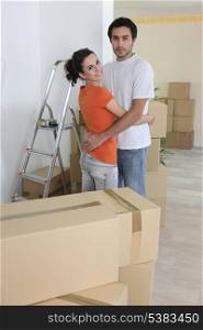 Couple hugging in new house