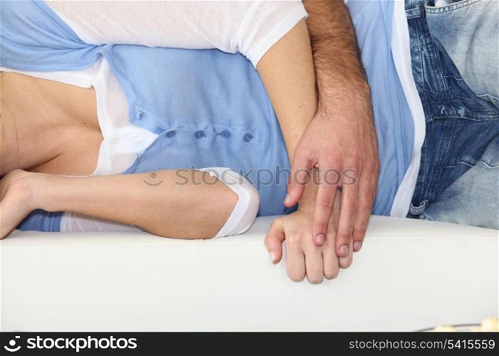 Couple hugging on a bed