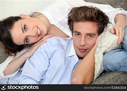 Couple hugging on a sofa