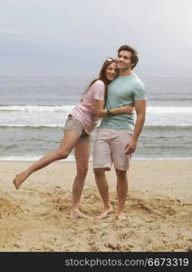 Couple hugging on beach