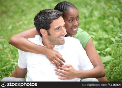 Couple hugging on the grass