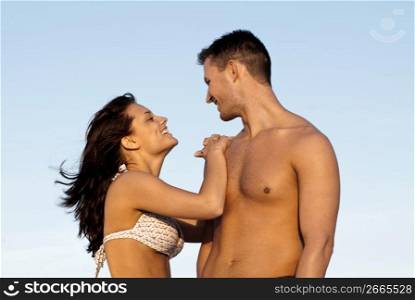 Couple in bathing suits standing together