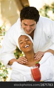 Couple in bathrobes, relaxing at health spa
