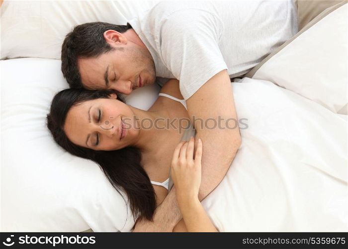 Couple in bed asleep