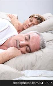 Couple in bed sleeping