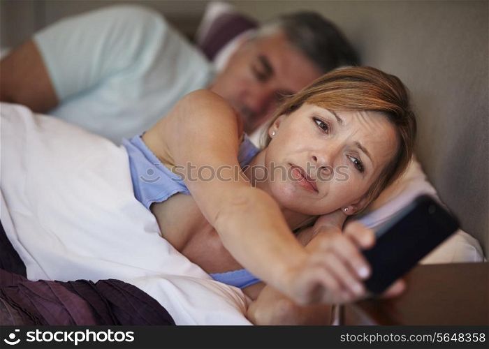 Couple In Bed With Wife Suffering From Insomnia