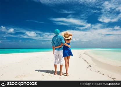 Couple in blue on a tropical beach at Maldives