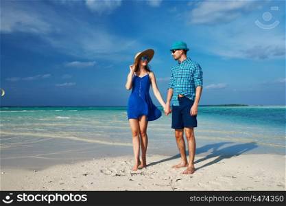 Couple in blue on a tropical beach at Maldives