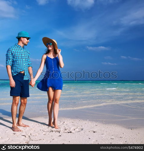 Couple in blue on a tropical beach at Maldives