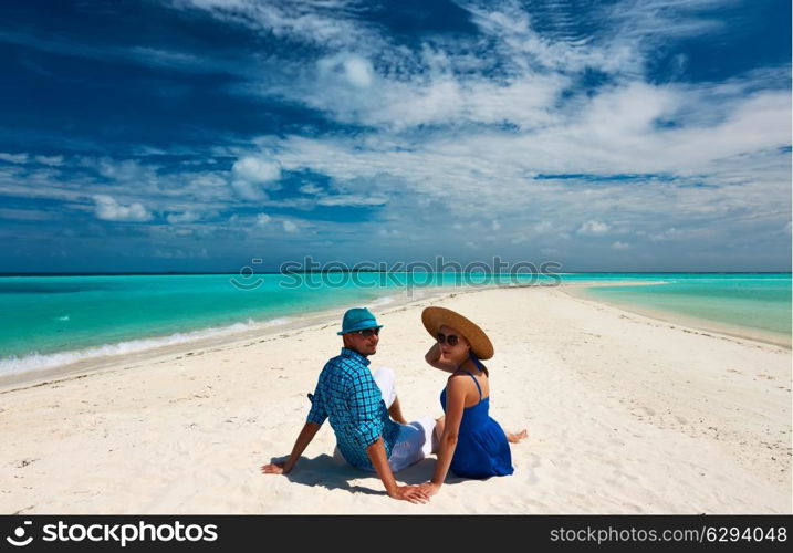 Couple in blue on a tropical beach at Maldives