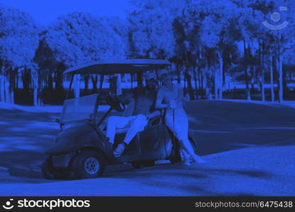 couple in buggy on golf course. couple in buggy cart on golf course duo tone