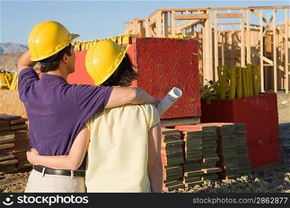 Couple in construction site