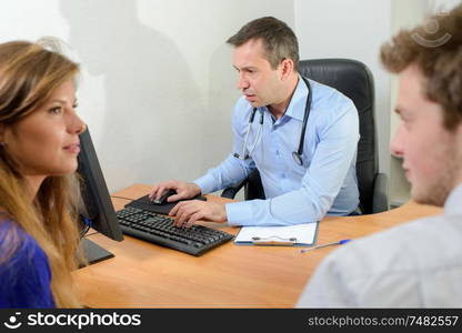 Couple in consultation with doctor