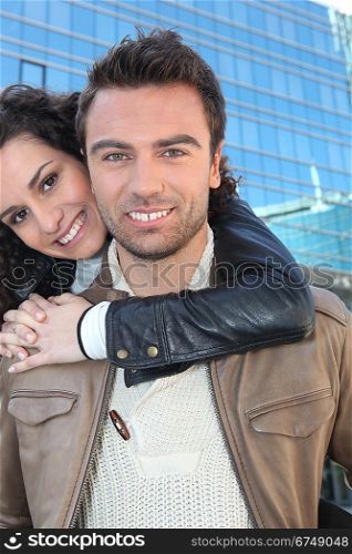 Couple in front of a building