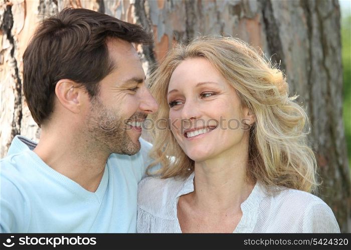 Couple in front of a tree