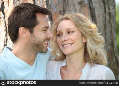 Couple in front of a tree