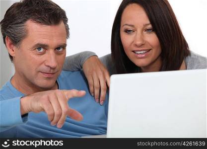 Couple in front of laptop