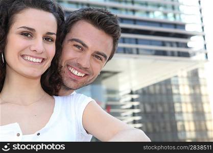 Couple in front of modern building