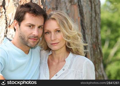 Couple in front of tree