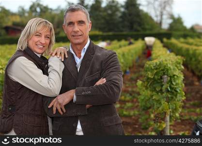 Couple in front of vineyard
