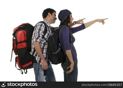 Couple in hiking gear pointing
