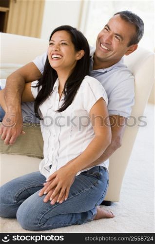 Couple in living room laughing