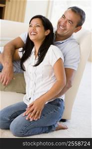 Couple in living room laughing