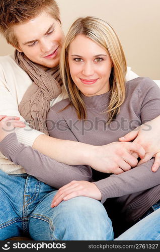 Couple in love - happy relax at home together in living room