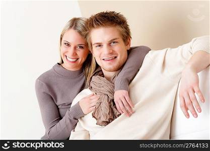 Couple in love - happy relax at home together in living room