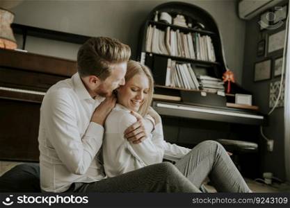 Couple in love having nice time together in the room at home