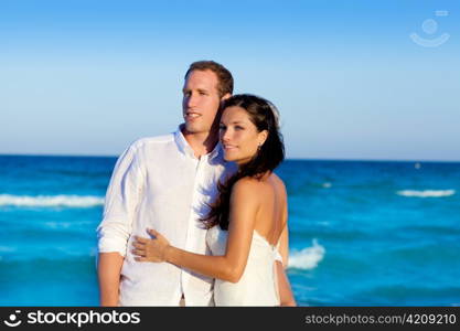 couple in love hug in blue sea vacation in Spain