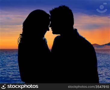 Couple in love hug in sunset on sea lake