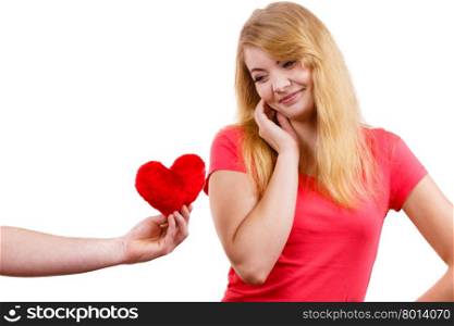 Couple in love. Man giving woman red heart . Couple. Boyfriend giving his girlfriend red heart love symbol. Happy romantic woman and man. Valentines day happiness concept