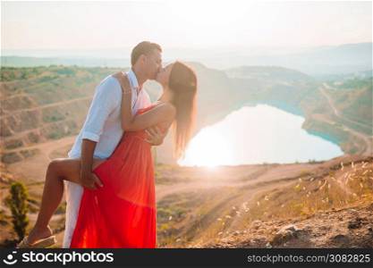 Couple in love near the lake like heart on honeymoon. Concept of european vacation. Beautiful landscape. Family near the lake at the day time.