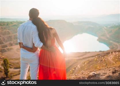 Couple in love near the lake like heart on honeymoon. Concept of european vacation. Beautiful landscape. Family near the lake at the day time.