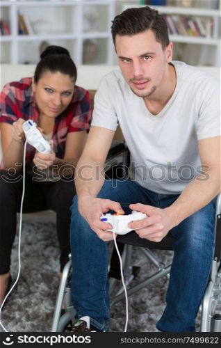 couple in love playing video games with joyspads