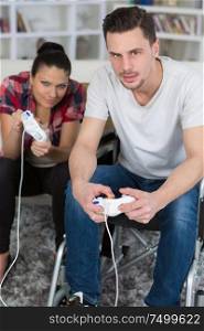 couple in love playing video games with joyspads