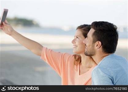 couple in love taking selfies outdoors