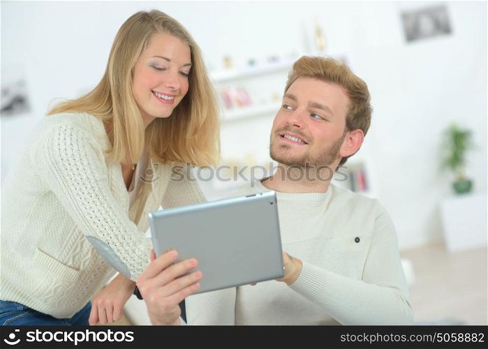 Couple in love with their tablet